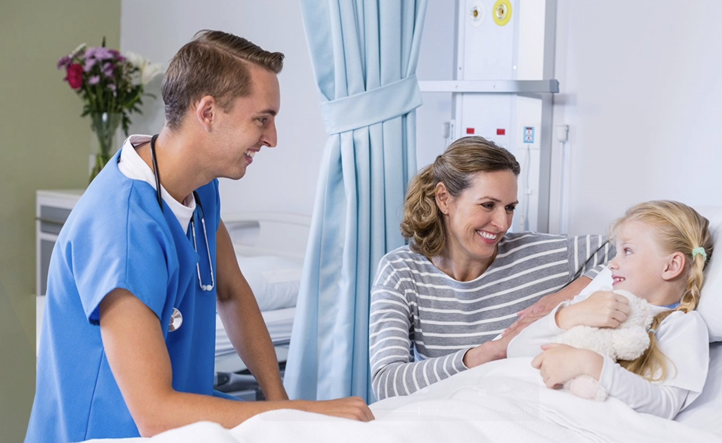 Male nurse with child patient and mother