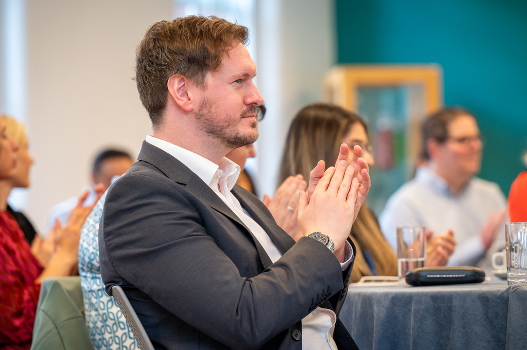 Conference audience clapping a speaker